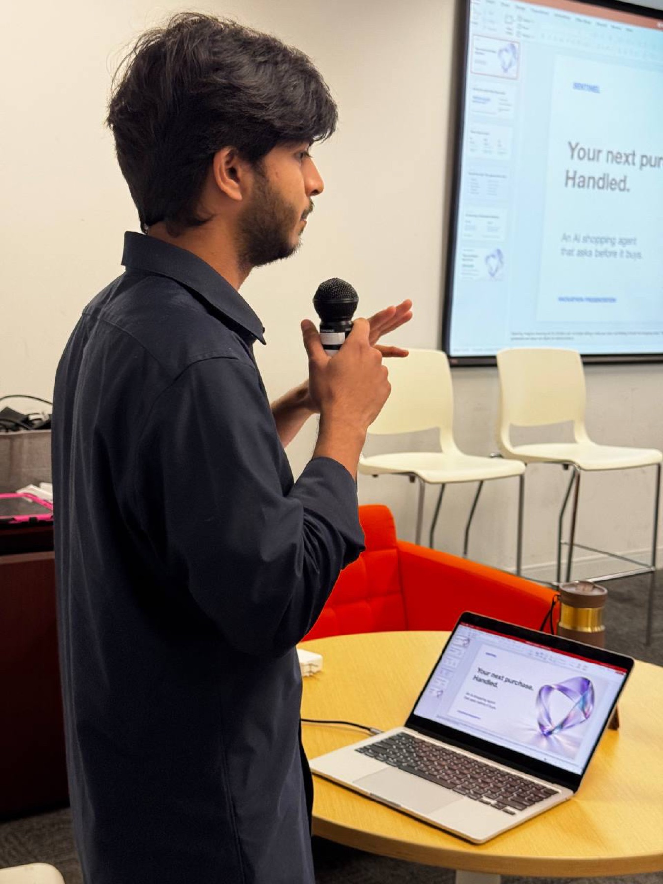 Sentinel presenter explaining the shopping agent to Demo Day attendees